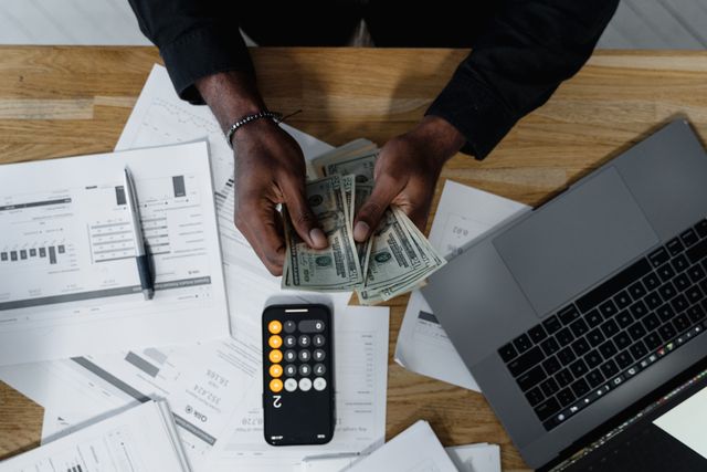 a person reviewing their finances at a desk